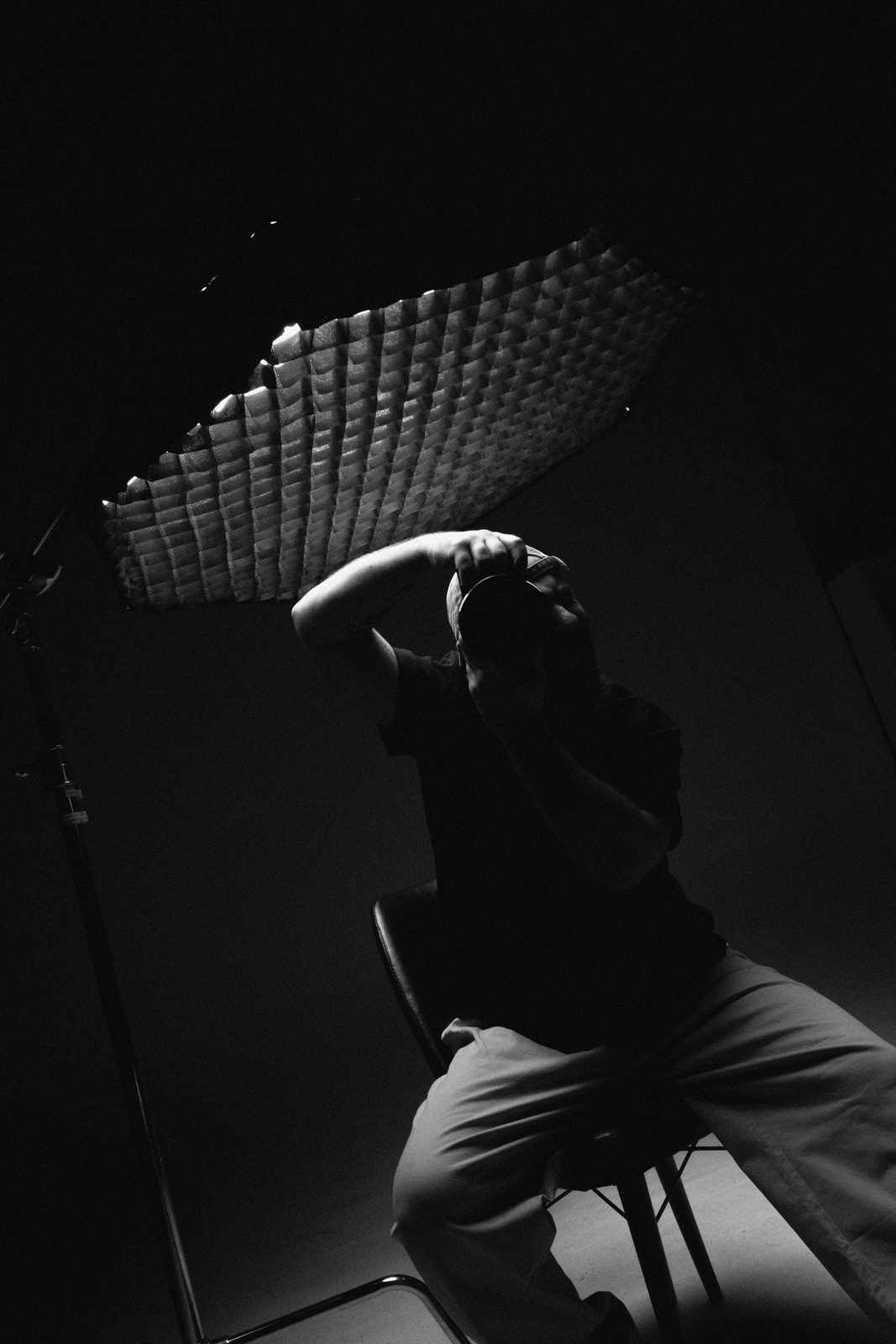 Haluk Köhserli setting up light in the studio